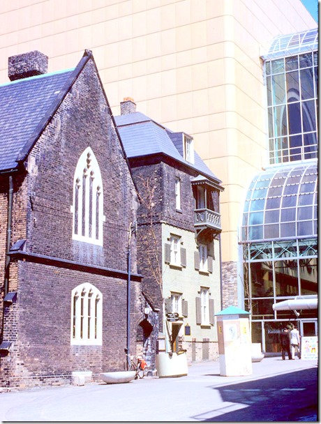 View of Church of the Holy Trinity, Scadding House, and Eaton's Centre – April 27, 1978